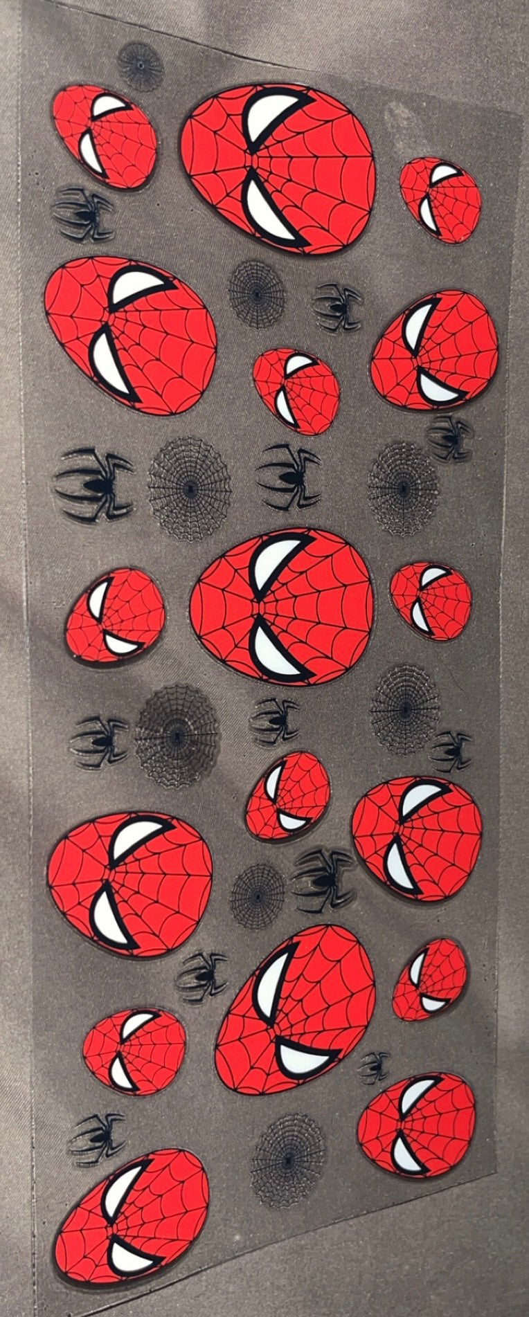 Spider man faces with spiders and webs