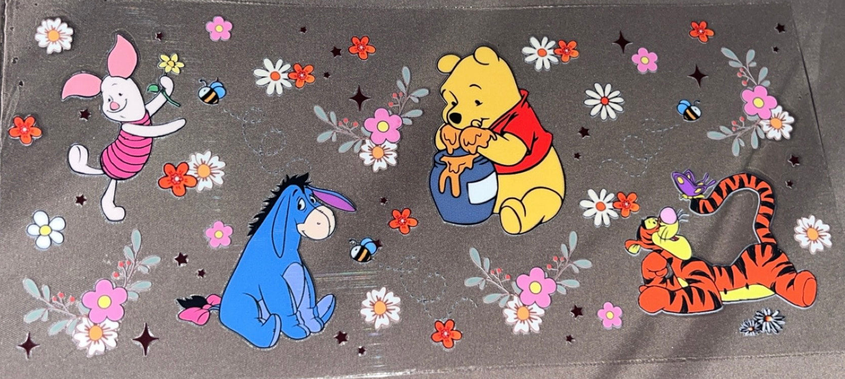 Whinne the Pooh and friends with flowers