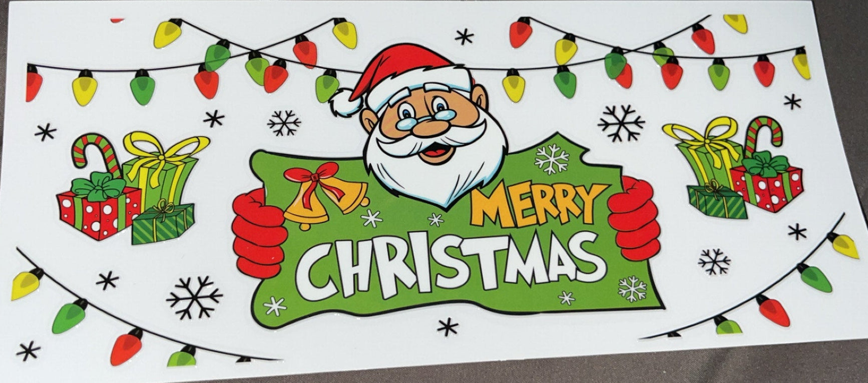 Santa with a Merry Christmas sign